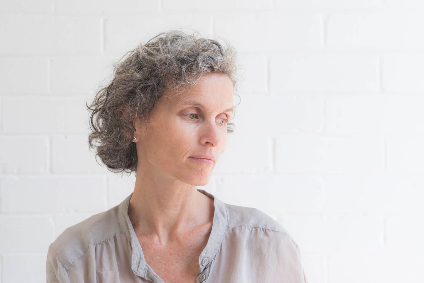 Natural looking middle aged woman looking away from camera